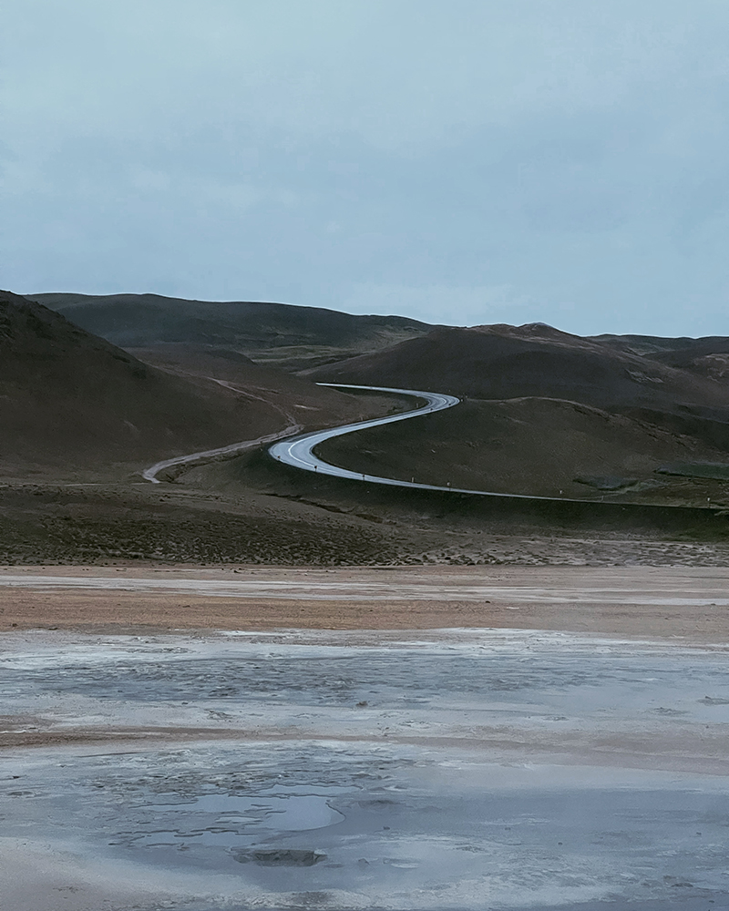 A road curves through the Icelandic landscape